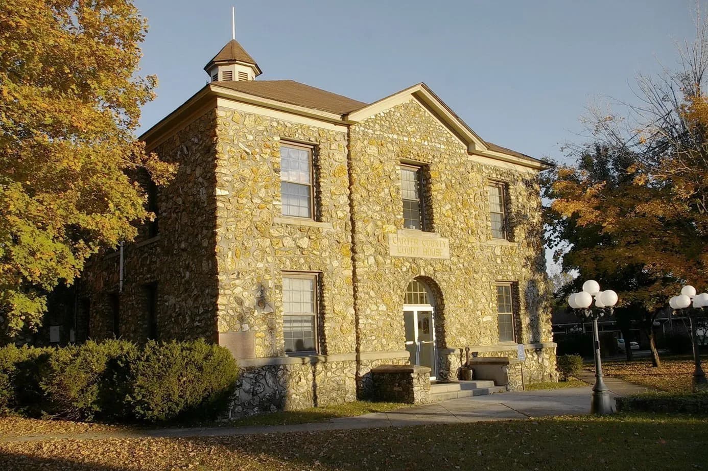 The cobblestone Carter County Courthouse in Van Buren in fall